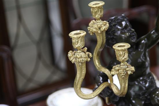 After Clodion. A pair of bronze and ormolu six light candelabra, height 28.5in.